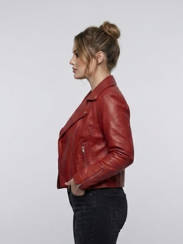 Side profile of women's red leather moto jacket featuring full-length sleeves.