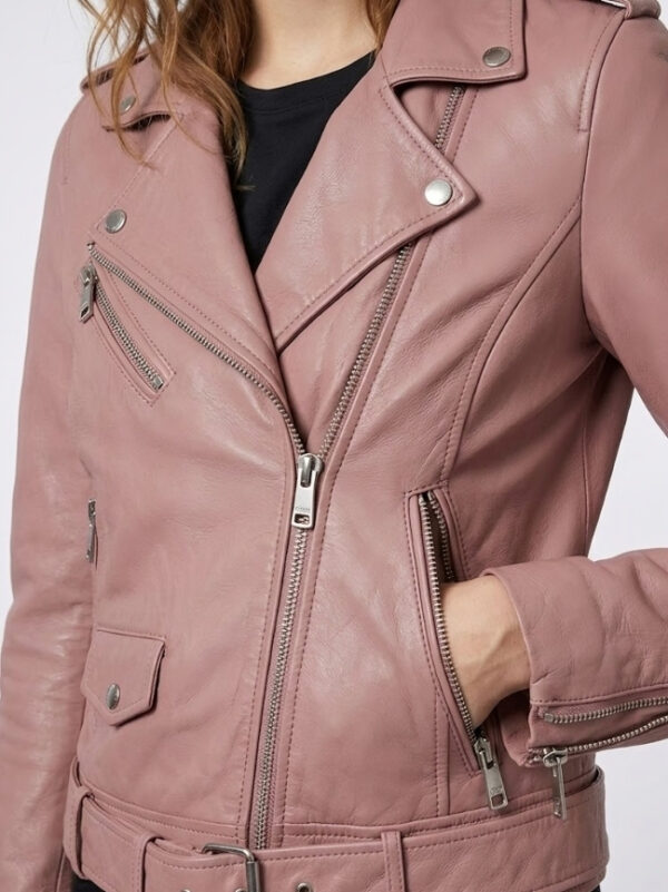 Close-up of notch lapel collar on light pink women's real leather moto jacket